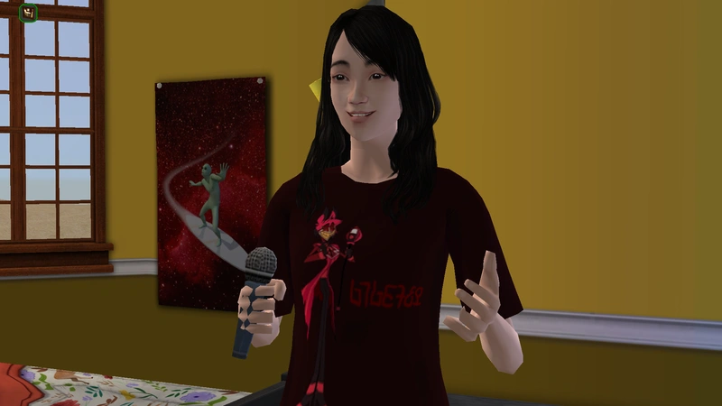 Penelope wearing the Alastor shirt with the microphone